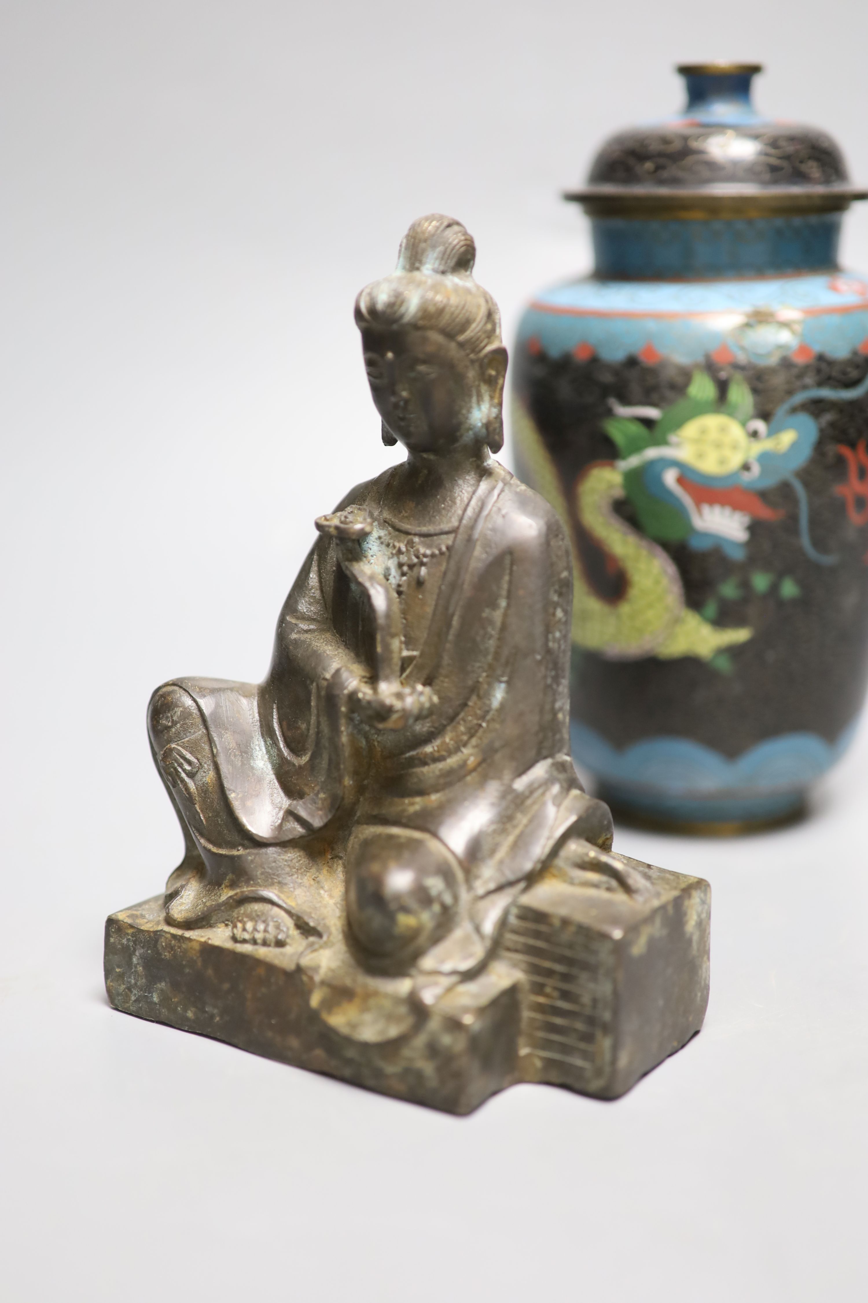 A Chinese bronze Buddha, height 17cm, a deity and cloisonne jar and cover